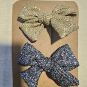 Lot de 2 pinces Noeuds dorées et noires pailletées